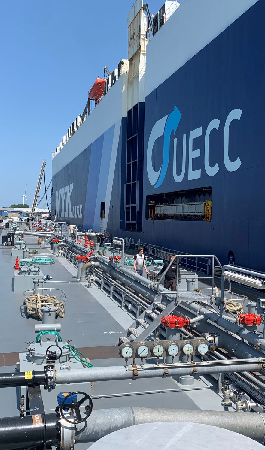 A portrait image of a car carrier being bunkered with sustainable biofuel