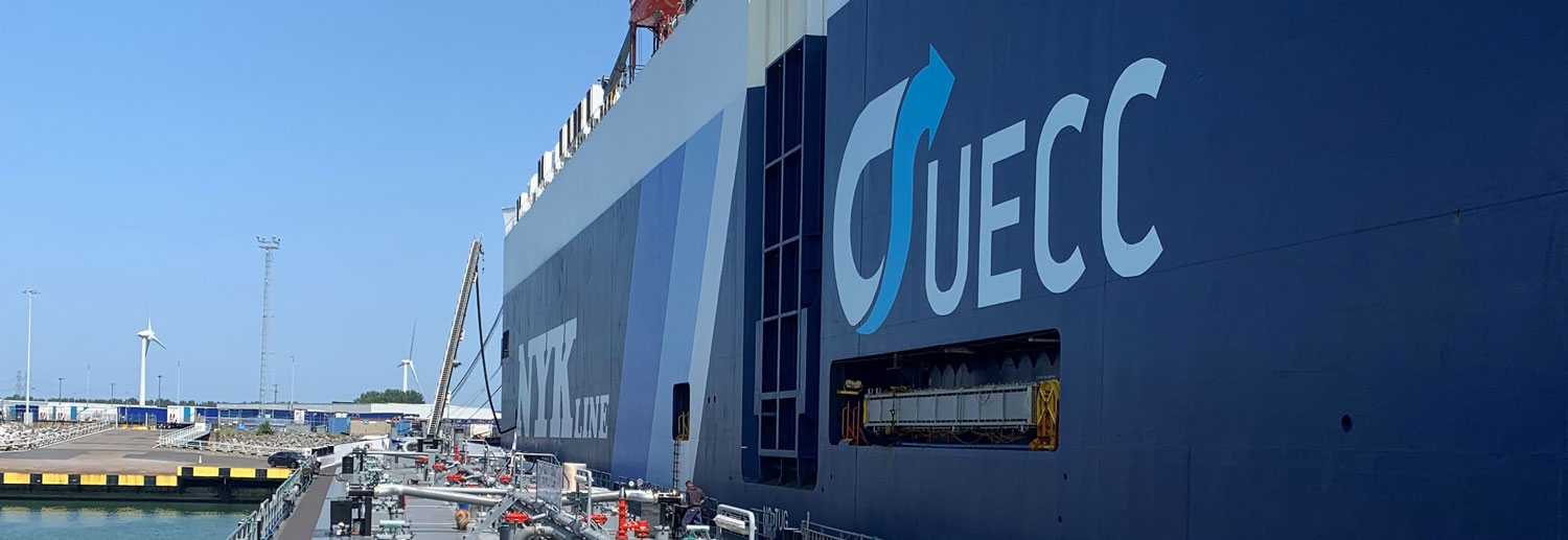 A landscape image of a car carrier being bunkered with sustainable biofuel